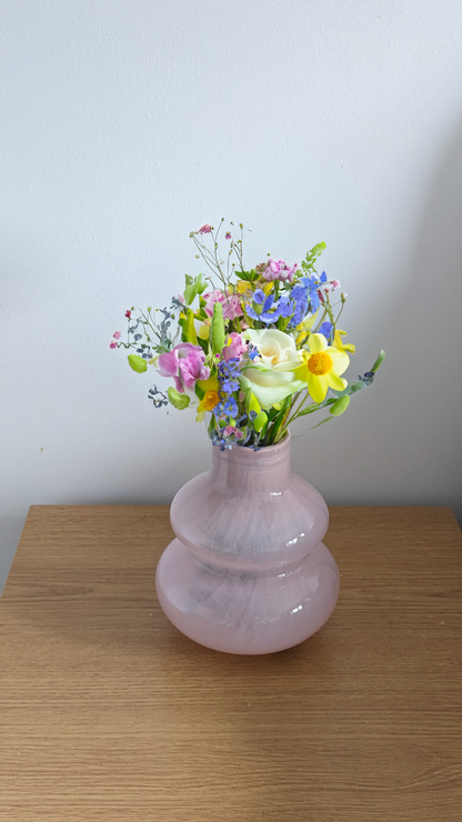 Mouth blown small curved vase in pink